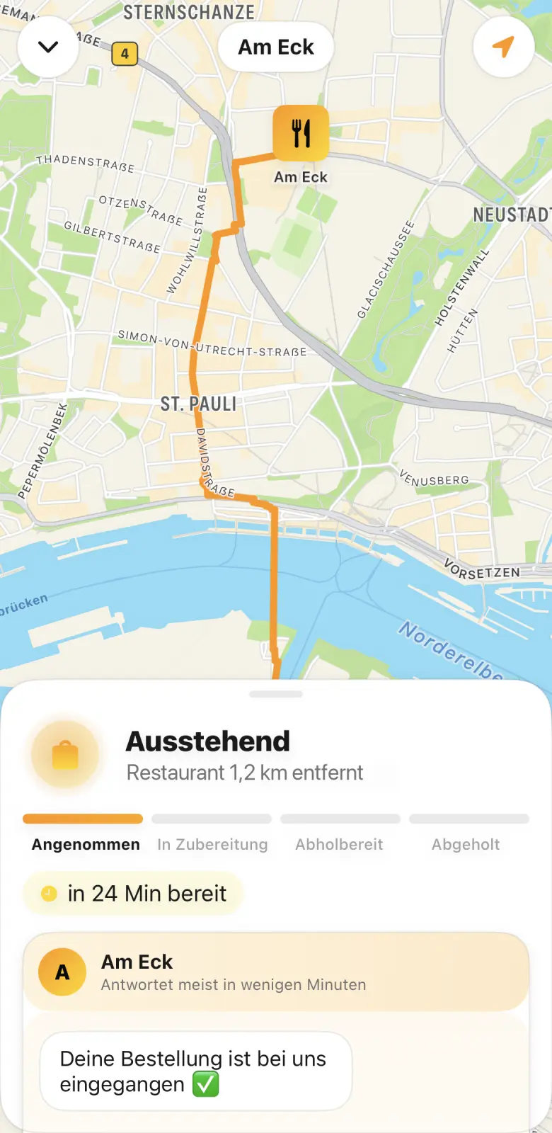 A map with the restaurant marked and the route to it, and below it the order's status across four stages from accepted to collected, with the time it will be ready.